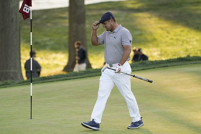 Bryson DeChambeau, of the United States, walks up to the 18th green Sunday during the final round of the US Open Golf Championship in Mamaroneck, N.Y. - Photo by John Minchillo of The Associated Press
