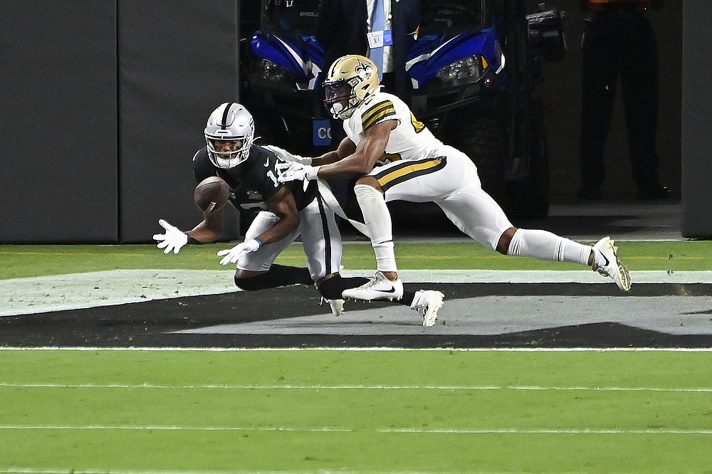 Las Vegas Raiders wide receiver Zay Jones, left, catches a touchdown against New Orleans Saints free safety Marcus Williams (43) during the first half of an NFL football game, Monday, Sept. 21, 2020, in Las Vegas. (AP Photo/David Becker)