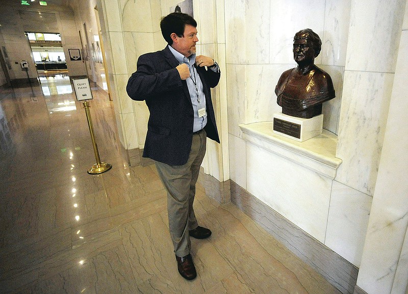 Steve Murray, director of the Alabama Department of Archives and History, pauses by a bust of former director Marie Bankhead Owen in Montgomery, Ala., on Thursday, Aug. 13, 2020. Murray and other current leaders of the agency are confronting the legacy of Owen, an ardent supporter of the "lost cause" version of Civil War history, as the nation grapples with the legacy of racial injustice. (AP Photo/Jay Reeves)