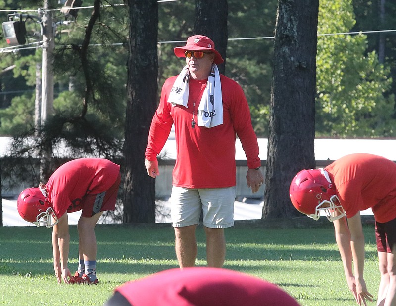 Mountain Pine head football coach Sam Counce runs a practice on Aug. 3. The Red Devils football team is quarantined for the next two weeks after an athlete tested positive for COVID-19. - Photo by Richard Rasmussen of The Sentinel-Record