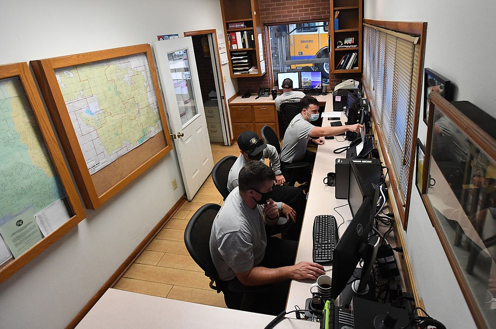 Springdale firefighters use a small room to work on computers for training and ongoing education Tuesday at Station No. 4. The Fire Department hopes to soon renovate the station. Go to nwaonline.com/200922Daily/ and nwadg.com/photos for a photo gallery. (NWA Democrat-Gazette/J.T. Wampler)