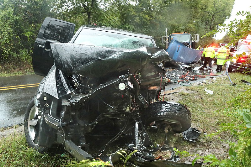 A Hot Springs man was injured in a two-vehicle wreck that occurred around 7:30 a.m. Wednesday in the 200 block of Kelton Street. Joseph Avellino, 36, of Hot Springs, driving a 2011 Dodge Ram 1500 pick-up, foreground, was southbound when he reportedly crossed the centerline and collided head-on with a northbound 2009 Kenworth truck driven by Rese Woods, 57, of Harrison, Hot Springs police Officer 1st Class Shawn Lowrey said. Avellino was transported by LifeNet to CHI St. Vincent Hot Springs where he was in stable condition while Woods was not injured, Lowrey said, noting the wreck was still under investigation. - Photo by Richard Rasmussen of The Sentinel-Record