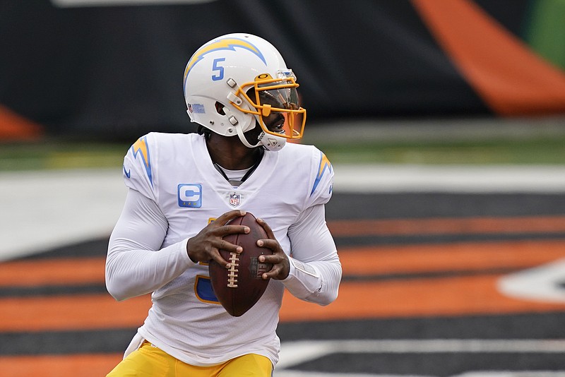 Los Angeles Chargers quarterback Tyrod Taylor (5) looks to throw during the first half of an NFL football game against the Cincinnati Bengals, Sunday, Sept. 13, 2020, in Cincinnati. (AP Photo/Bryan Woolston)