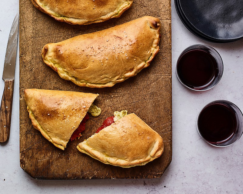 Roasted Tomato, Mozzarella and Pesto Calzones (The New York Times/Andrew Purcell)