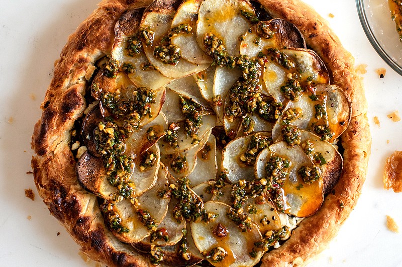 A spinach and chermoula pie. Until better times, stick to hugging those in your bubble, but make this for those you’re able to share food with or deliver food to. (The New York Times/Andrew Scrivani)