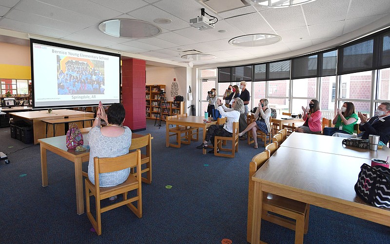 Teachers and administrators gather Thursday Sept. 24, 2020 in the library at Bernice Young Elementary School in Springdale as it was announced that the school was recognized as a National Blue Ribbon School for 2020. The recognition comes from the United States Department of Education and is based on the school's overall academic performance or progress in closing achievement gaps among student subgroups. Visit nwaonline.com/200924Daily/ and nwadg.com/photos for more photos. (NWA Democrat-Gazette/J.T.WAMPLER)