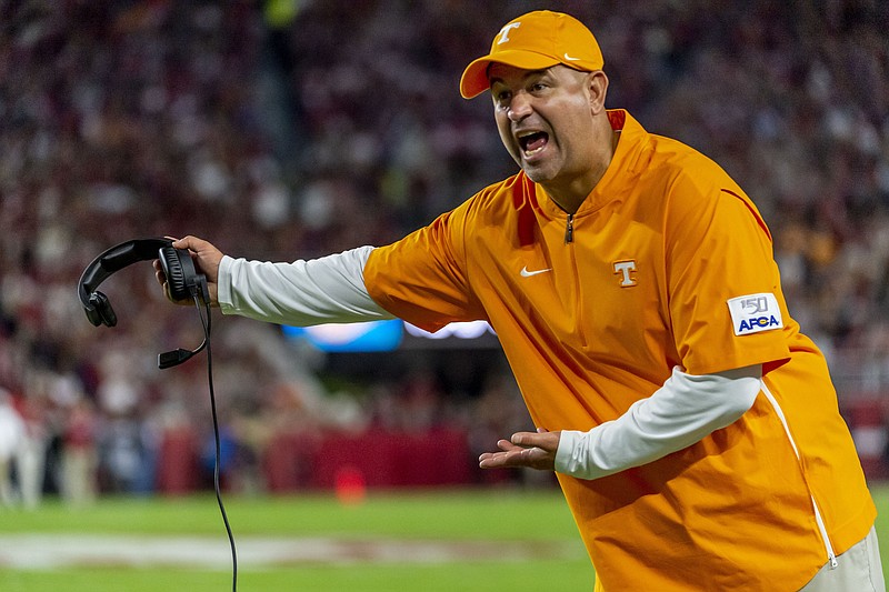 FILE - In this Oct. 19, 2019, file photo, Tennessee head coach Jeremy Pruitt argues a call during the first half of an NCAA college football game against Alabama, in Tuscaloosa, Ala. No. 16 Tennessee has given coach Jeremy Pruitt a raise and a contract extension through 2025 after two seasons on the job.  Tennessee announced the extension Thursday, Sept. 24, 2020, that will hike Pruitt's pay from $3.8 million this season to $4.2 million in 2021. (AP Photo/Vasha Hunt, File)