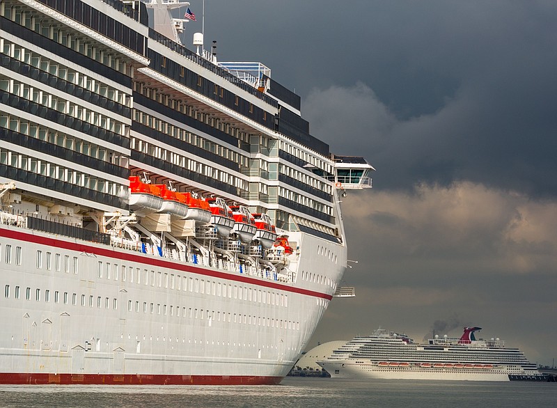 The Carnival Corp. Miracle and Panorama cruise ships sit acnhored at the Port of Long Beach in Long Beach, Calif., on April 13, 2020. MUST CREDIT: Bloomberg photo by Tim Rue.