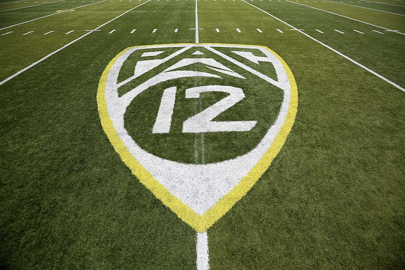 FILE- In this Oct. 10, 2015, file photo, a PAC-12 logo is displayed on the field before an NCAA college football game between Washington State and Oregon in Eugene, Ore. The Pac-12 university presidents and chancellors will meet Friday, Sept. 17, 2020, and be presented options for staging a fall football season, but Commissioner Larry Scott says a vote by the the CEO Group is not expected. (AP Photo/Ryan Kang, File)