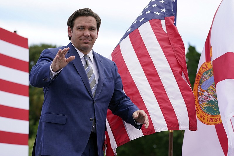 Florida Gov. Ron DeSantis attends an event with President Donald Trump on the environment at the Jupiter Inlet Lighthouse and Museum, Tuesday, Sept. 8, 2020, in Jupiter, Fla. (AP Photo/Evan Vucci)