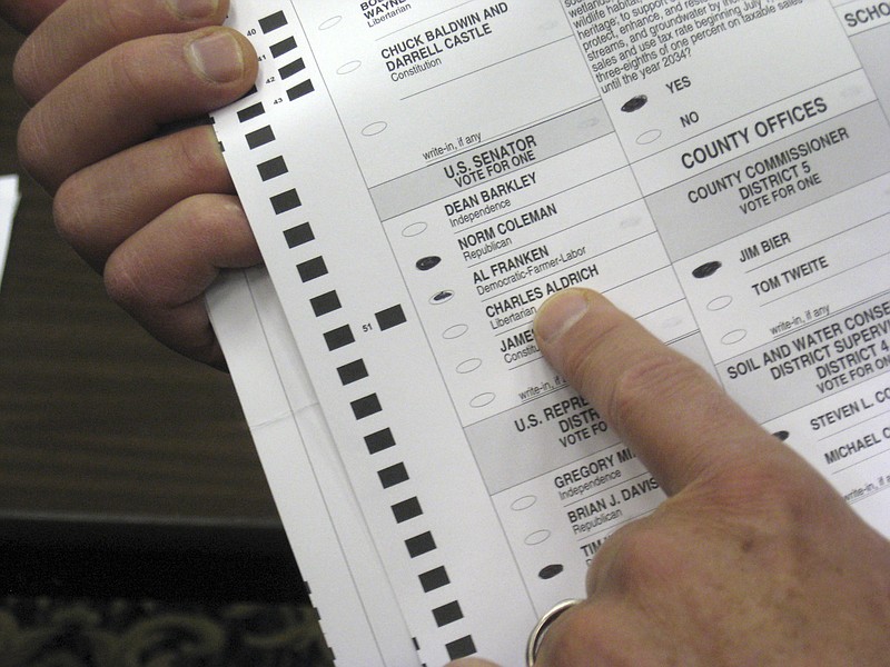 FILE - In this Nov. 19, 2008, file photo, a ballot in Rochester, Minn., with markings next to both candidates, was challenged by both the Coleman and Franken campaigns on the first day of the recount for Minnesota's U.S. Senate election. Amid the global pandemic, more people than ever are expected to bypass their polling place and cast absentee ballots for the first time. Voters marking ballots from home could lead to an increase in the kinds of mistakes that typically would be caught by a scanner or election worker at the polls.  (Sea Stachura/Minnesota Public Radio via AP, File)