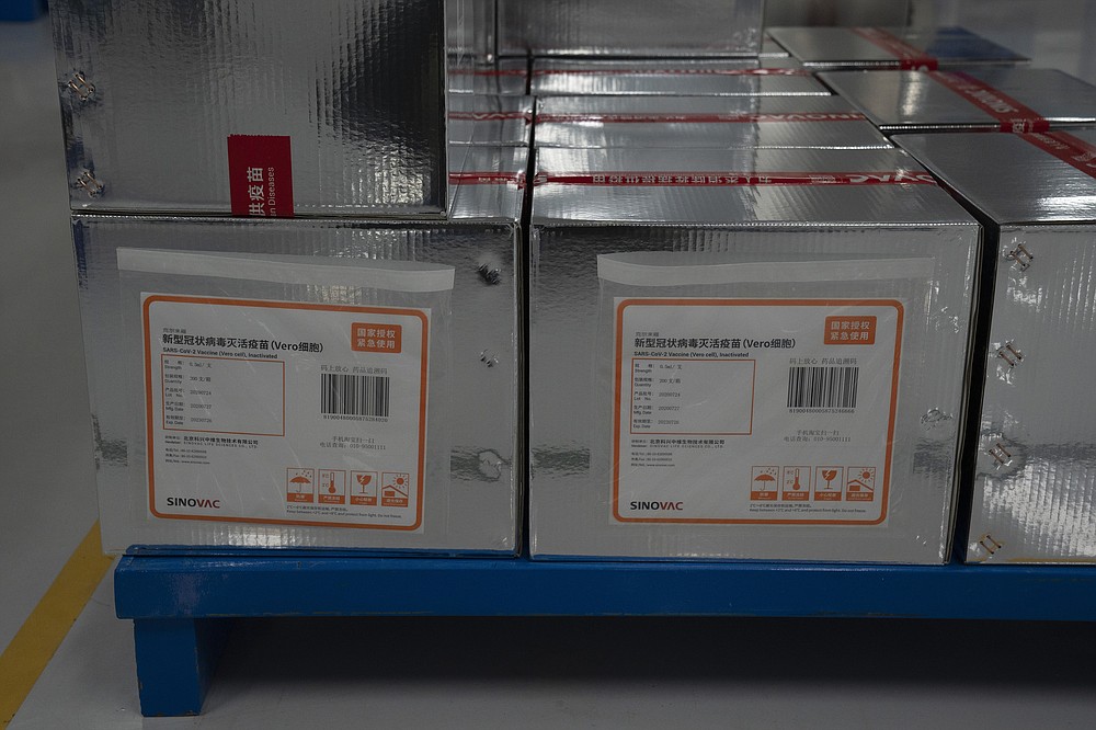 Boxes of SARS CoV-2 Vaccine for COVID-19 stamped with the words "State Authorized, Emergency Use" produced by SinoVac are stacked at its factory in Beijing on Thursday, Sept. 24, 2020. Under an emergency use regulation, hundreds of thousands of people in China have been given Chinese vaccines, before final regulatory approval for general use. It's a highly unusual move that raises ethical and safety questions, as companies and governments worldwide race to develop a vaccine that will stop the spread of the new coronavirus. (AP Photo/Ng Han Guan)
