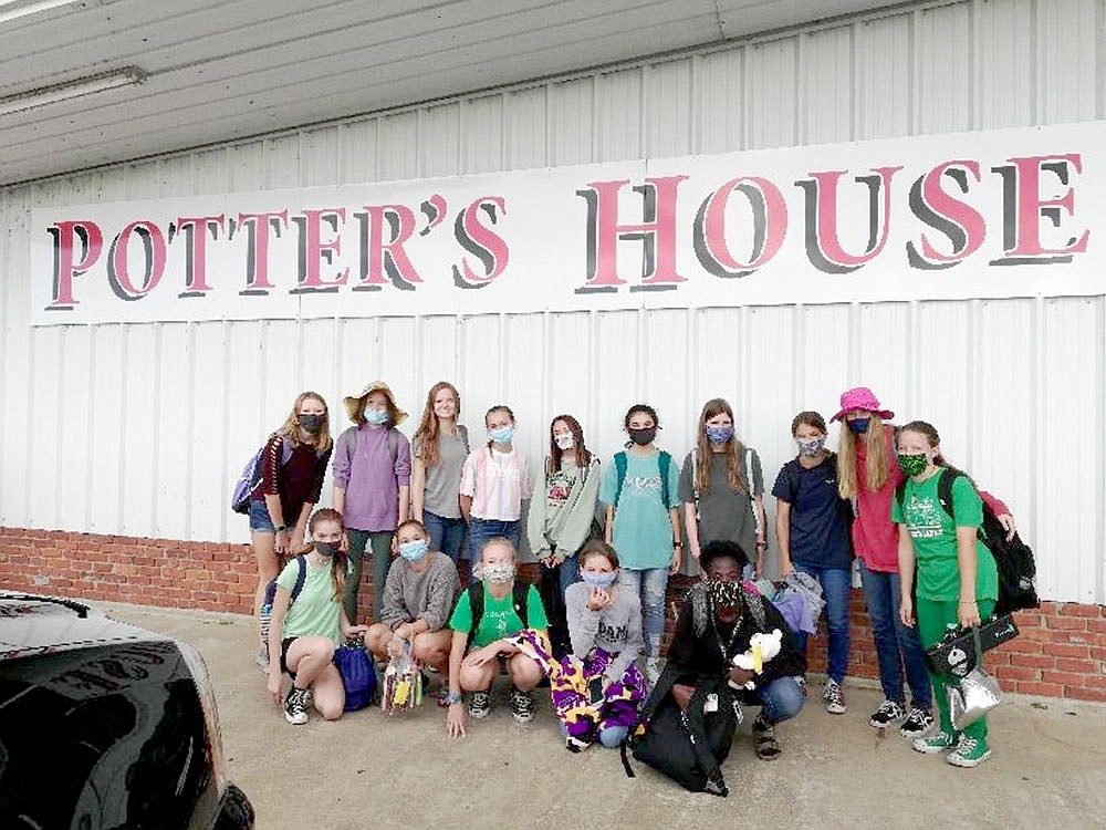 Cross country program volunteers at Potter's House