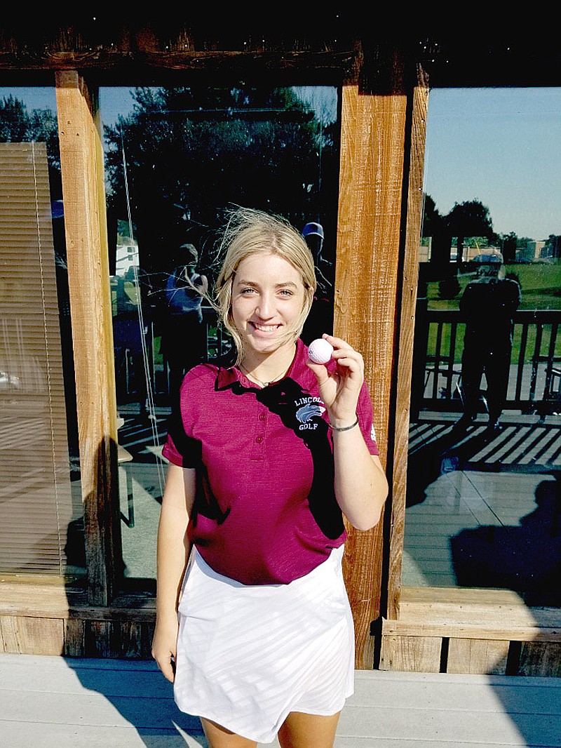 Submitted photo/Lincoln senior Paige Umberson celebrates a hole-in-one. Umberson made the shot on the 10th hole while competing during the District 3A-1 Golf meet held at "The Creeks" at Cave Springs on Friday, which was also Umberson's 18th birthday. She shot a 125 to help the Lady Wolves bring home the second place trophy and qualify for state.