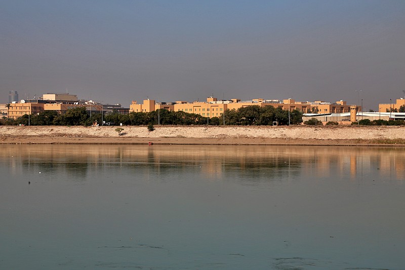 FILE - The U.S. Embassy is seen from across the Tigris River in Baghdad, Iraq Jan. 3, 2020. The Trump administration has signaled it could close its diplomatic mission in Baghdad if measures are not taken to control rogue armed elements responsible for a recent spate of attacks against U.S. and other interests in the country, Iraqi and U.S. officials said Monday, Sept. 28, 2020. (AP Photo/Khalid Mohammed, File)