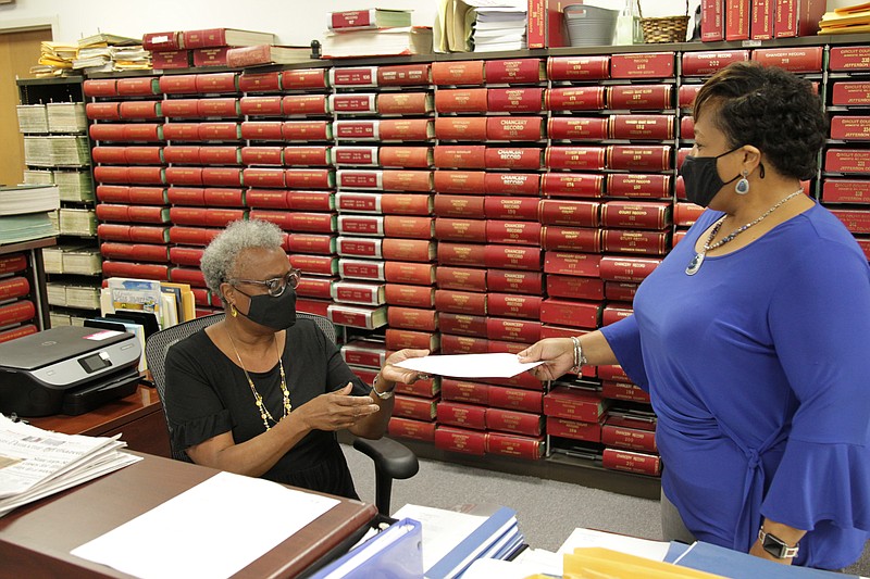 Chief Deputy Circuit Clerk Flora Cook-Bishop and Deputy Circuit Clerk Barbara Collins at work in the Circuit Clerk's office on Tuesday afternoon. Retiring Circuit Clerk Lafayette Woods Sr. has recommended Collins to succeed him as interim circuit clerk to fill out the remainder of his unexpired term, which expires Dec. 31, 2022. Because the appointed interim clerk cannot run to succeed herself, Woods did not ask the Quorum Court to consider Bishop for the position, saying she intends to run for the office in 2022. (Pine Bluff Commercial/Dale Ellis)