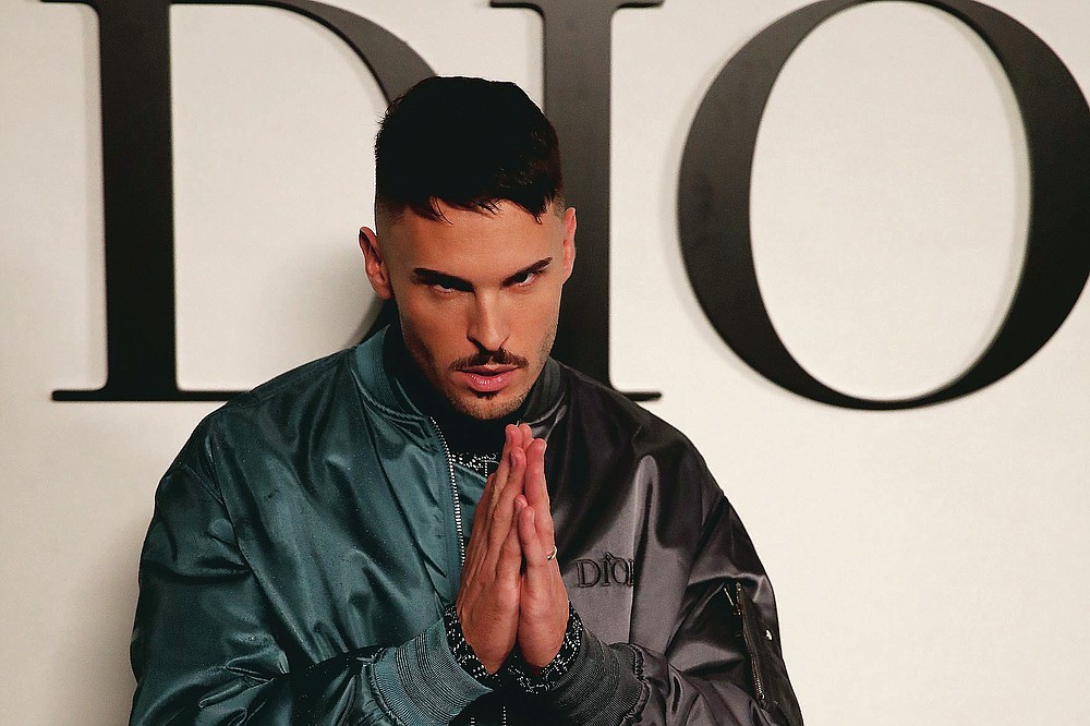 French model Baptiste Giabiconi poses before Dior's Spring-Summer 2021 fashion collection Tuesday, Sept. 29, 2020 before the show during the Paris fashion week. (AP Photo/Francois Mori)