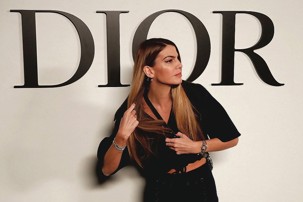 Italian actress Bianca Brandolini poses before Dior's Spring-Summer 2021 fashion collection Tuesday, Sept. 29, 2020 before the show during the Paris fashion week. (AP Photo/Francois Mori)