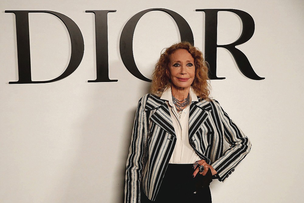 Actress Marisa Berenson poses before Dior's Spring-Summer 2021 fashion collection Tuesday, Sept. 29, 2020 before the show during the Paris fashion week. (AP Photo/Francois Mori)