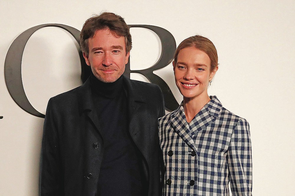 Natalia Vodianova and Antoine Arnault pose before Dior's Spring-Summer 2021 fashion collection Tuesday, Sept. 29, 2020 before the show during the Paris fashion week. (AP Photo/Francois Mori)