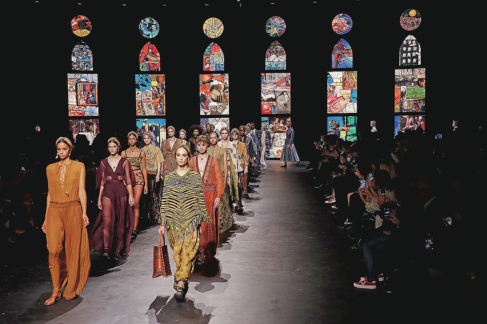 Models wear creations during Dior's Spring-Summer 2021 fashion collection presented Tuesday, Sept. 29, 2020 during the Paris fashion week. (AP Photo/Francois Mori)