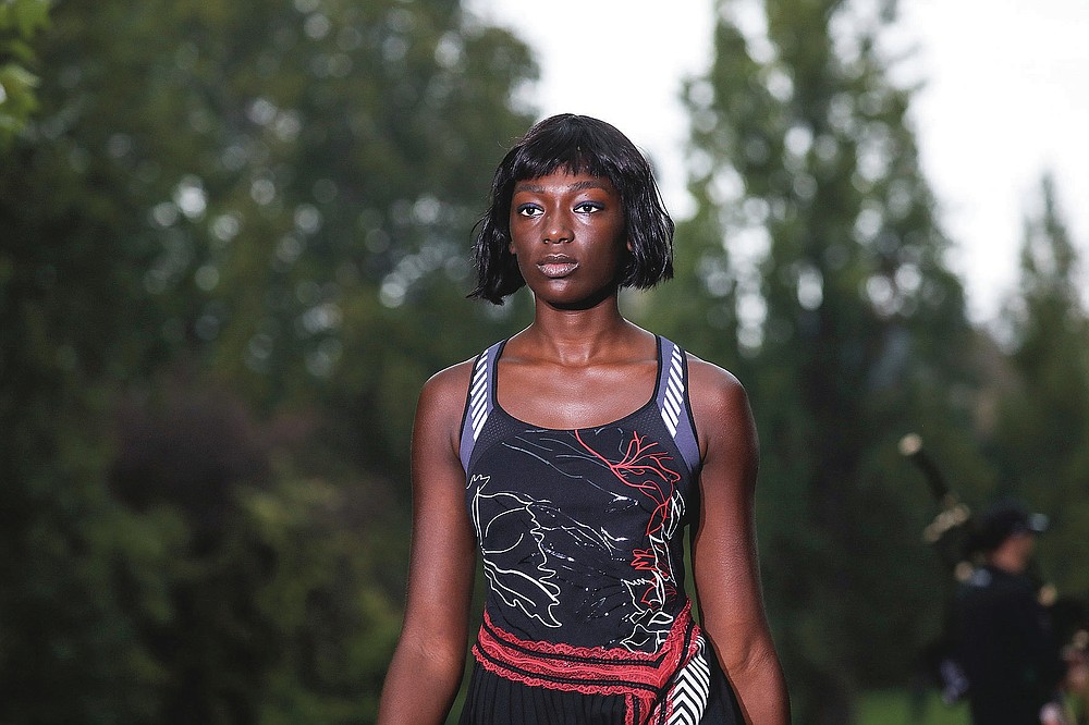 A model wears a creation for the Koche Spring-Summer 2021 fashion collection, Tuesday, Sept. 29, 2020, during Paris fashion week. (Photo by Vianney Le Caer/Invision/AP)