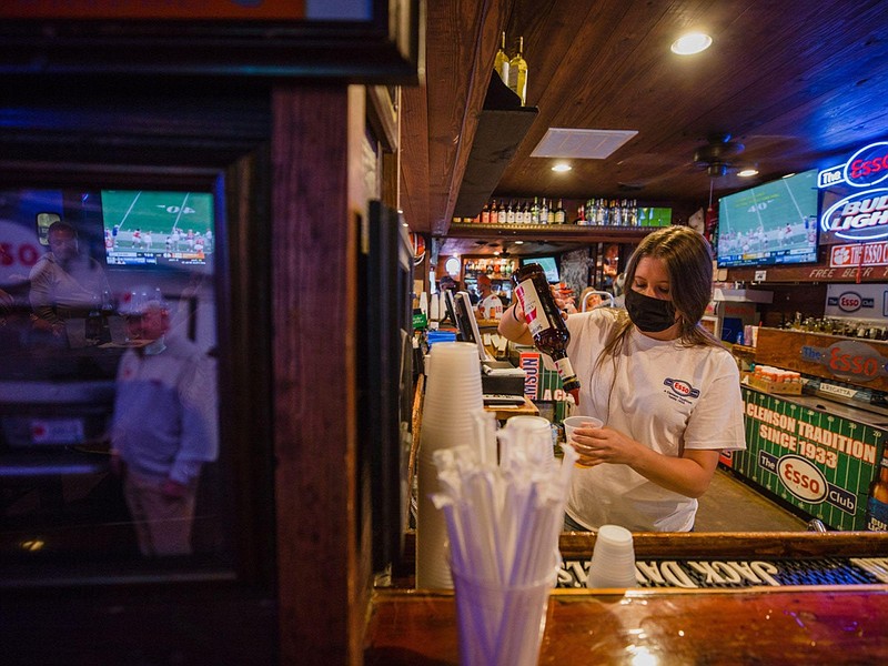 A bartender prepares a drink at a restaurant during Clemson University's first home football game in Clemson, S.C., on Sept. 19, 2020. (Bloomberg photo by Micah Greene)