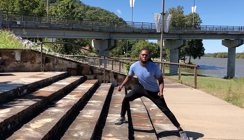 Emmanuel Eyiuche does step 2 of the  Sidestep Staircase on a short set of stairs beside Two Rivers Park Bridge in Little Rock. (Arkansas Democrat-Gazette/Celia Storey)