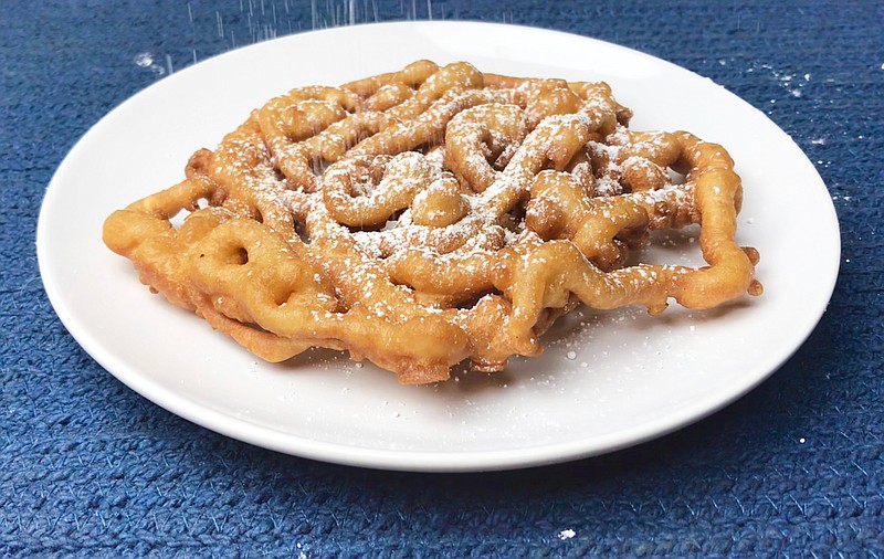 A homemade Funnel Cake is showered with confectioners' sugar (Arkansas Democrat-Gazette/Kelly Brant)