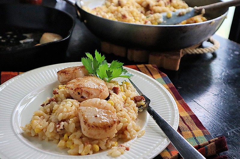 Seared scallops on top of corn and chorizo risotto is an easy and satisfying fall dish. (Gretchen McKay/Pittsburgh Post-Gazette/TNS)