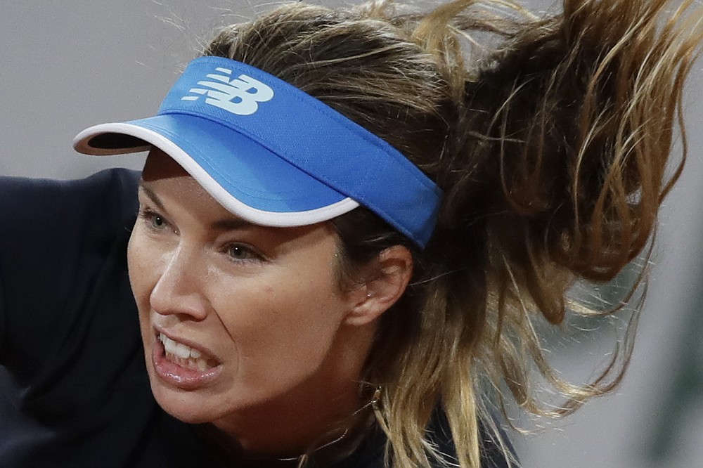 Danielle Collins of the U.S. plays a shot against Spain's Garbine Muguruza in the third round match of the French Open tennis tournament at the Roland Garros stadium in Paris, France, Saturday, Oct. 3, 2020. (AP Photo/Alessandra Tarantino)