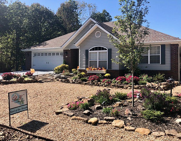 Photo submitted Ginny Vance and spouse Dieter Schoreit of 5 Glencoe Lane in Bella Vista have been selected as the Bella Vista Garden Club Yard of the Month for October.