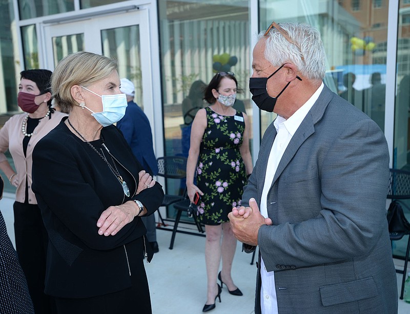 Jane Hunt Meade (left) speaks Tuesday, Oct. 6, 2020, with Mike Russell, a member of the Fayetteville Public Library Foundation Board and capital campaign director, during an announcement for a $5 million gift from the Hunt family to the library's expansion project. The facility is set to be open by the end of the year. Visit nwaonline.com/2001007Daily/ for today's photo gallery. 
(NWA Democrat-Gazette/Andy Shupe)