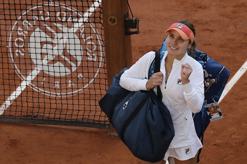 Sofia Kenin of the U.S. celebrates winning her quarterfinal match of the French Open tennis tournament against Danielle Collins of the U.S. in three sets 6-4, 4-6, 6-0, at the Roland Garros stadium in Paris, France, Wednesday, Oct. 7, 2020. (AP Photo/Alessandra Tarantino)