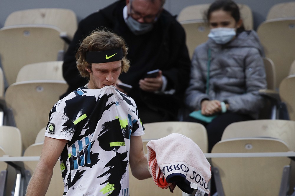 Russia's Andrey Rublev walks back to his bench after losing a game in the quarterfinal match of the French Open tennis tournament against Greece's Stefanos Tsitsipas at the Roland Garros stadium in Paris, France, Wednesday, Oct. 7, 2020. (AP Photo/Alessandra Tarantino)
