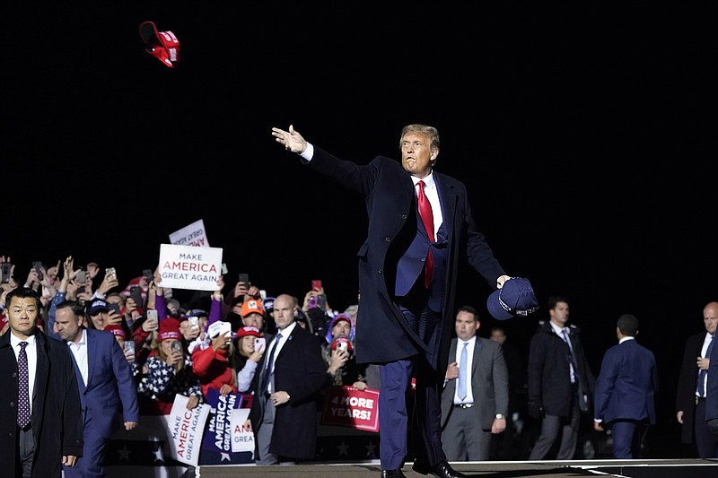 FILE - In this Wednesday, Sept. 30, 2020 file photo, President Donald Trump throws hats to supporters after speaking at a campaign rally at Duluth International Airport in Duluth, Minn. (AP Photo/Alex Brandon) story.lead_photo.caption