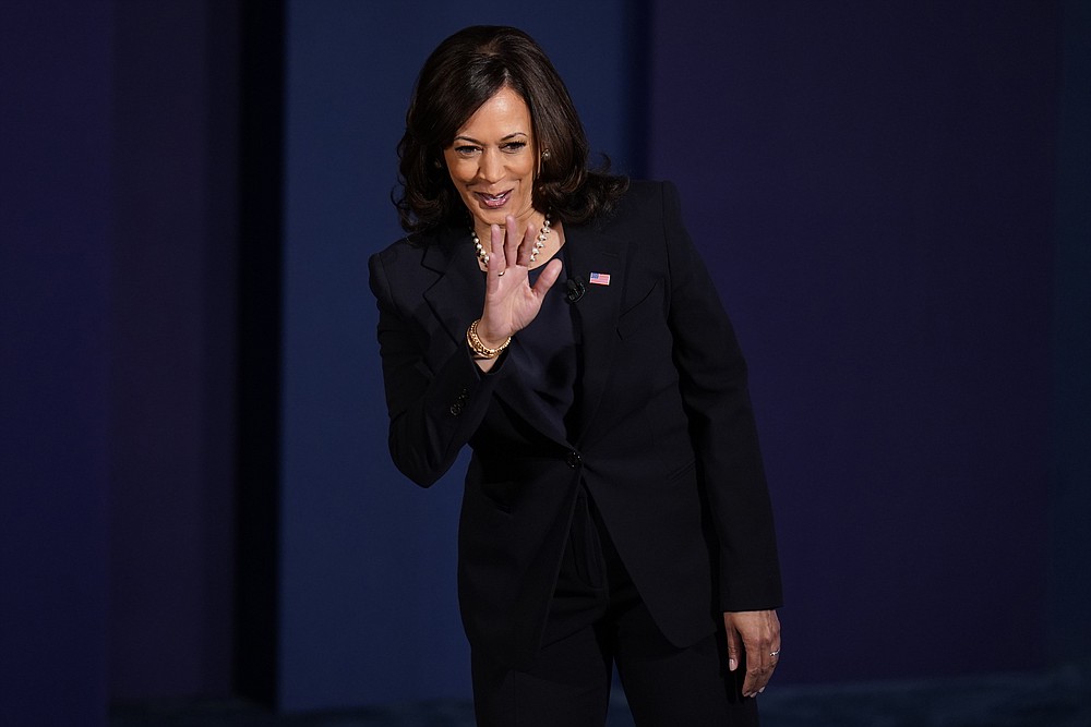 Democratic vice presidential candidate Sen. Kamala Harris, D-Calif., waves as she arrives on stage for the vice presidential debate with Vice President Mike Pence Wednesday, Oct. 7, 2020, at Kingsbury Hall on the campus of the University of Utah in Salt Lake City. (AP Photo/Julio Cortez)