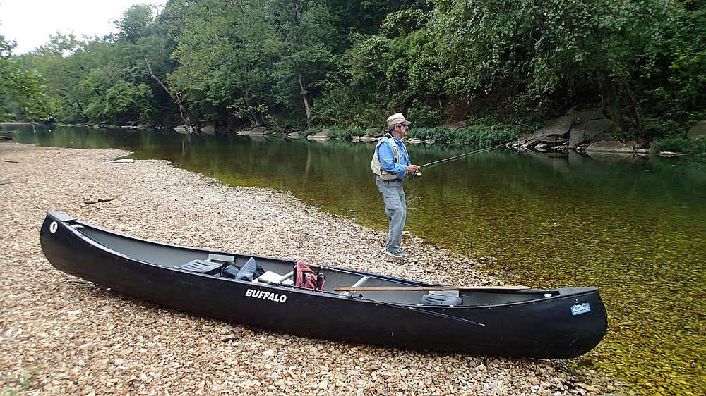 Ozark streams like the Elk River can be at their lowest Sept. 11 2020 levels in autumn. Tonkinsin fishes the clear water during a stop for lunch.
(NWA Democrat-Gazette/Flip Putthoff)