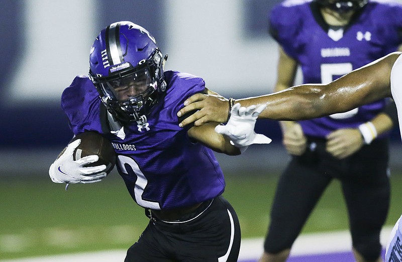 Fayetteville Kameron Ingram (2) carries the ball, Friday, October 9, 2020 during a football game at Fayetteville High School in Fayetteville. Check out nwaonline.com/2010010Daily/ for today's photo gallery. 
(NWA Democrat-Gazette/Charlie Kaijo)