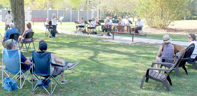 Keith Bryant/The Weekly Vista
A crowd gathers as the Ecumenical Church Orchestra, led by Lois Carlson, plays patriotic music outside the Veterans Wall of Honor during the Patriots, God and Country tour stop in Bella Vista.