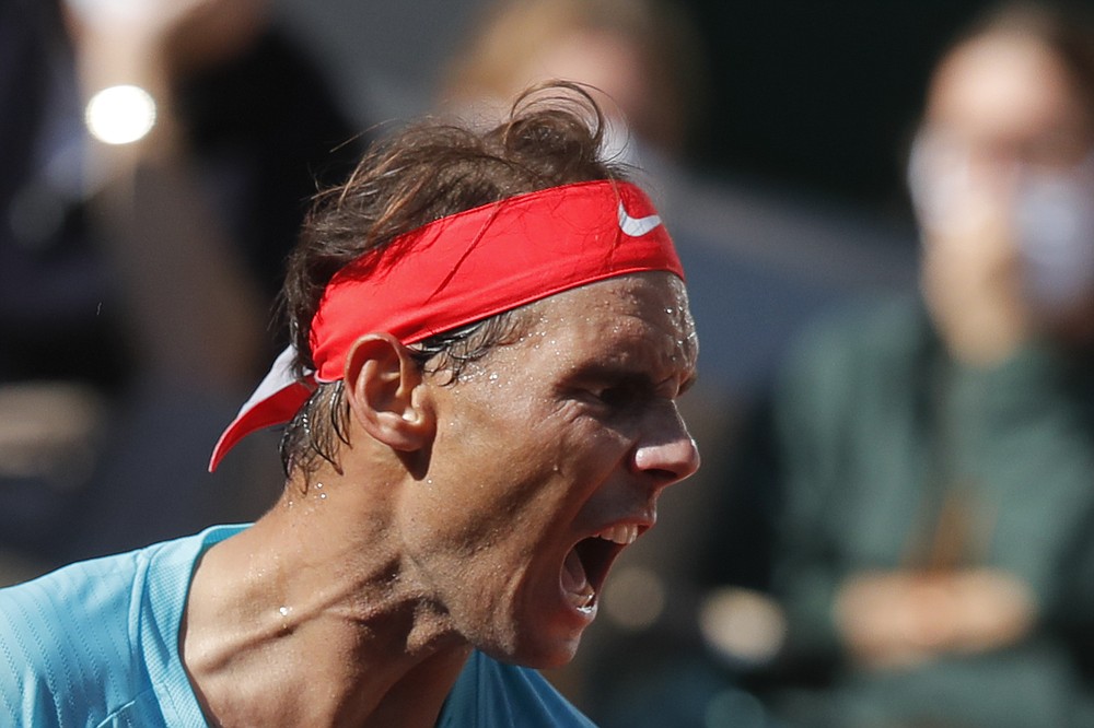 Spain's Rafael Nadal screams after scoring a point against Argentina's Diego Schwartzman in the semifinal match of the French Open tennis tournament at the Roland Garros stadium in Paris, France, Friday, Oct. 9, 2020. (AP Photo/Michel Euler)