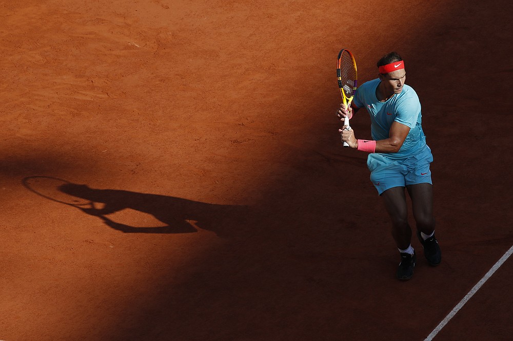 Spain's Rafael Nadal plays a shot against Argentina's Diego Schwartzman in the semifinal match of the French Open tennis tournament at the Roland Garros stadium in Paris, France, Friday, Oct. 9, 2020. (AP Photo/Alessandra Tarantino)
