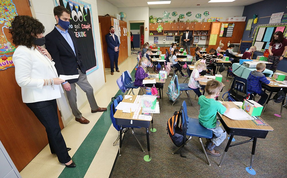 Principal Victoria Groomer (left), and U.S. Sen. Tom Cotton observe Friday, October 9, 2020, the first grade class of Natalie Johnson at Gentry Primary School in Gentry. Cotton toured the school to get a first hand look at how the district is handling the pandemic and to observe protocols that have put in place. Check out nwaonline.com/201010Daily/ and nwadg.com/photos for a photo gallery.(NWA Democrat-Gazette/David Gottschalk)