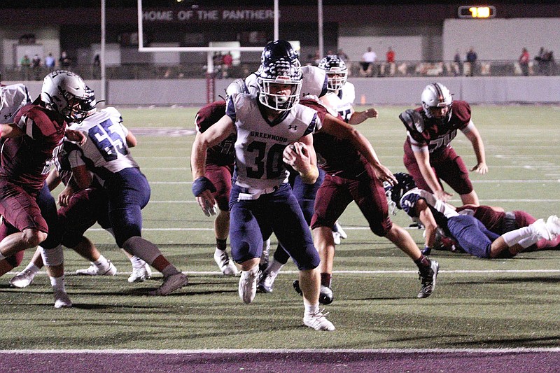Greenwood Bulldog Hunter Wilkenson (30) runs into the endzone to score against Siloam Springs Panthers Friday, October 9, 2020, at Panther Stadium, Siloam Springs, Arkansas (Special to NWA Democrat-Gazette/Brent Soule)