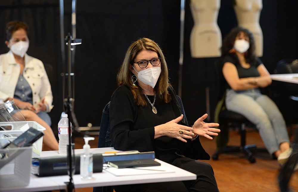 Fashion designer Kathleen Schwarz of Dallas speaks Saturday, Oct. 10, 2020, while taking part in the Arkansas Arts and Fashion Forum's Emerge program at the Creative Arkansas Community Hub & Exchange, formerly Arts Center of the Ozarks, in Springdale. The group is working to create an artist residency to connect local talent with national and international leaders in apparel and fashion design. Visit nwaonline.com/201011Daily/ for today's photo gallery.
(NWA Democrat-Gazette/Andy Shupe)