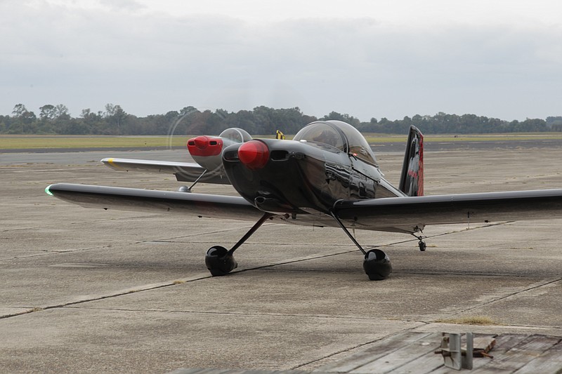 Two RV experimental aircraft sit on the tarmac at Grider Field this weekend, engines running, preparing to take off as part of a four-ship formation fun as pilots sharpen their formation flying abilities with highly experienced formation pilots there to critique and grade their performance. These homebuilt aircraft can be assembled for as little as $50,000 or can be customized with premium engine, communications, and avionics options that can easily top $250,000. (Pine Bluff Commercial/Dale Ellis)