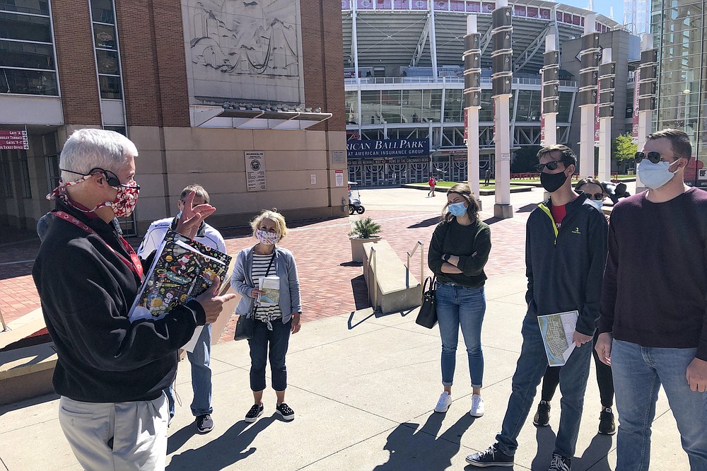 People tour the Cincinnati Reds Hall of Fame and Museum in