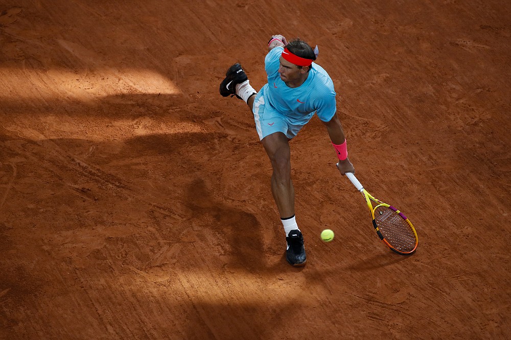 Spain's Rafael Nadal plays a shot against Serbia's Novak Djokovic in the final match of the French Open tennis tournament at the Roland Garros stadium in Paris, France, Sunday, Oct. 11, 2020. (AP Photo/Alessandra Tarantino)