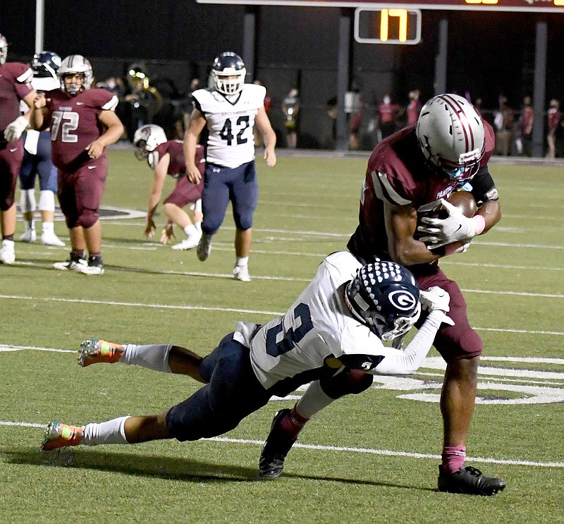 Bud Sullins/Special to the Herald-Leader
Siloam Springs senior Keegan Soucie tries to break away from Greenwood's Jayden Jasna during last Friday's football game at Panther Stadium. The Panthers travel to Lake Hamilton on Friday.