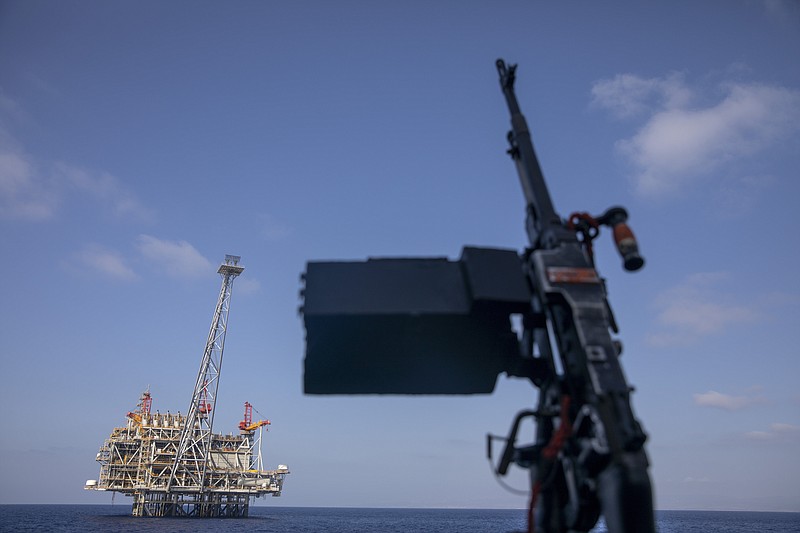 File - In this Tuesday, Sept. 29, 2020 file photo, Israel's offshore Leviathan gas field is seen from on board the Israeli Navy Ship Lahav during a rare tour in the Mediterranean Sea, Israel. Five years after Israel signed a landmark agreement to develop large offshore gas fields over the objections of antitrust authorities, environmentalists and consumer advocates, ordinary Israelis have yet to see the windfall promised by the government. (AP Photo/Ariel Schalit, File)